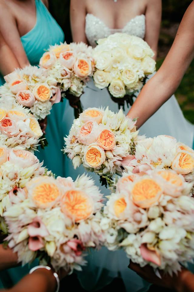 Bouquets of hydrangea, garden roses, blushing bride, and calla lilies