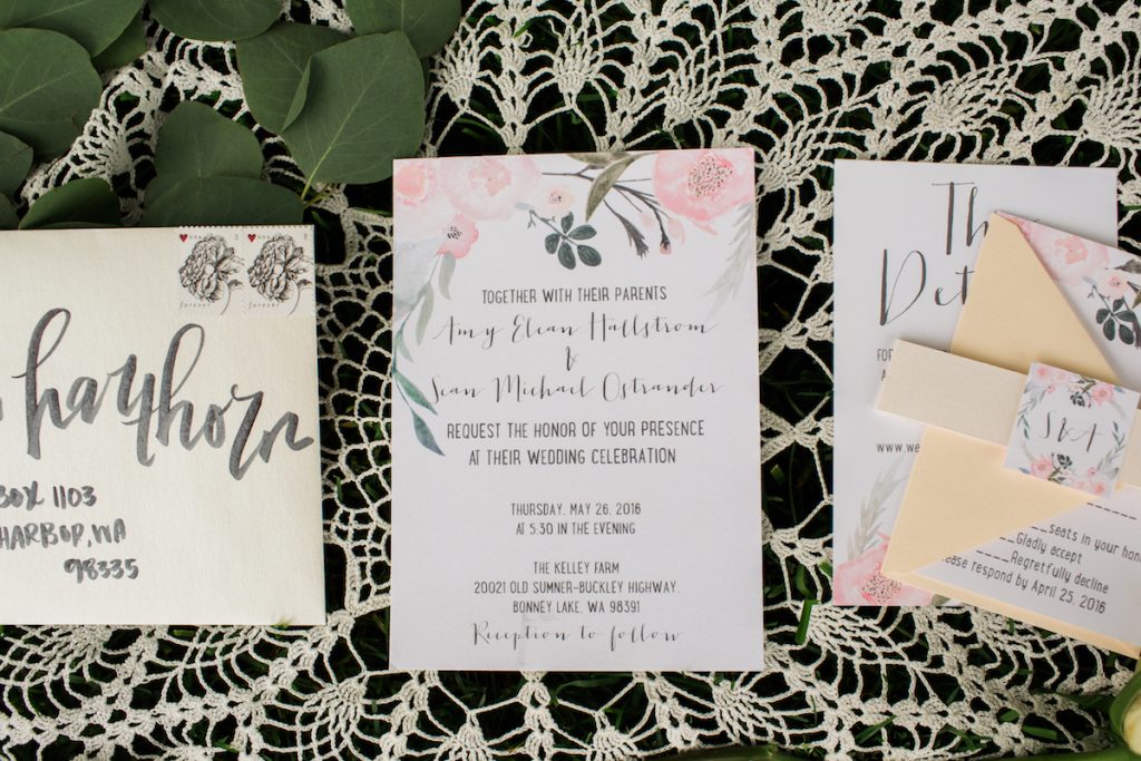 Floral Invitations with brushed calligraphy envelopes.