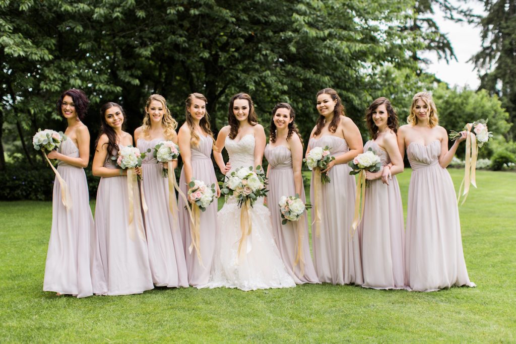 Bride with bridesmaids at Kelley Farm. Bouquets by Jen's Blossoms