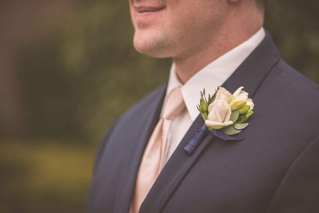 Spray rose boutonniere by Jen's Blossoms.  Tacoma Wedding