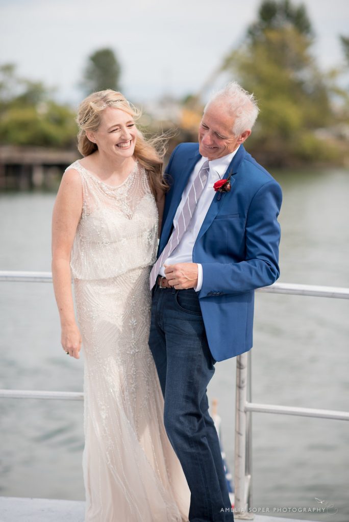 Bride and Groom on boat in Puget Sound; Foss Waterway Seaport