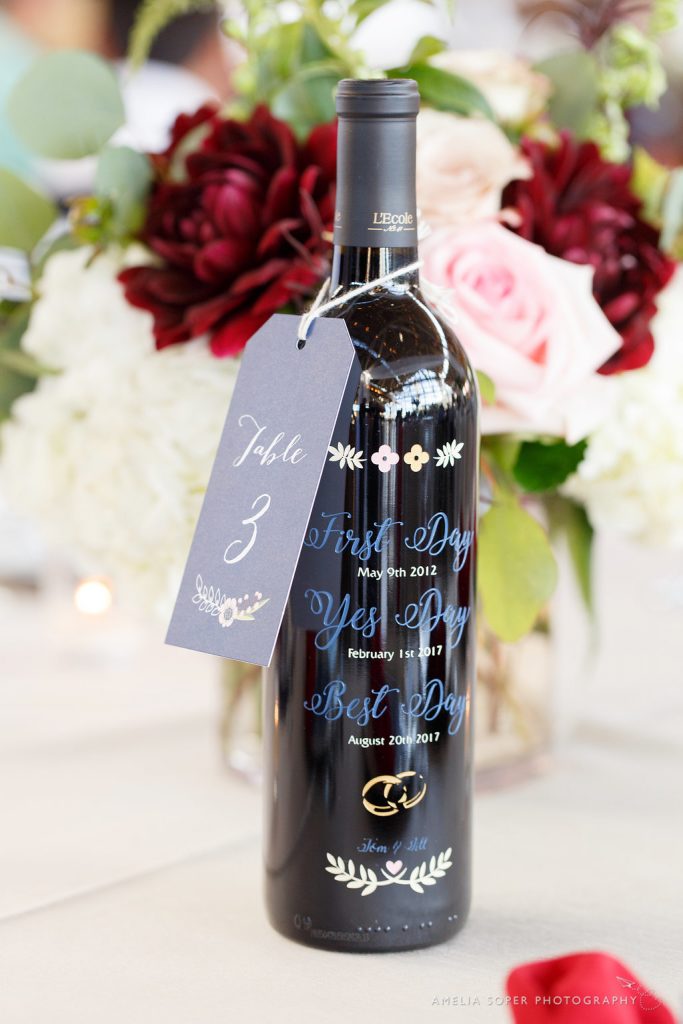 Engraved wine bottle table numbers.  Number tags by Paper Luxe.  Foss Waterway Seaport Tacoma Wedding