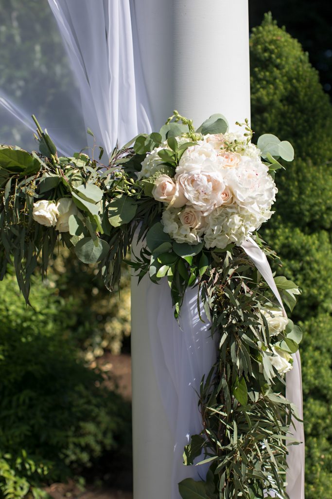 Ceremony draping pull back at Laurel Creel Manor; flowers by Jen's Blossoms