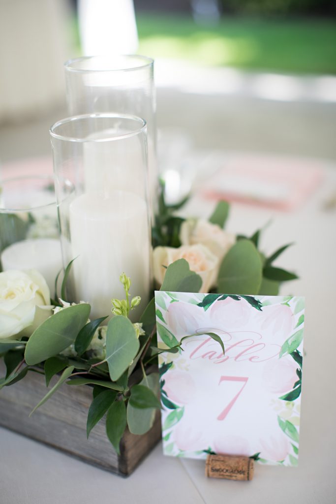 Wood box of greens, flowers, and candles by Jen's Blossoms