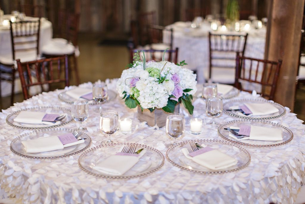 Low lush centerpiece in a rustic wood box by Jen's Blossoms