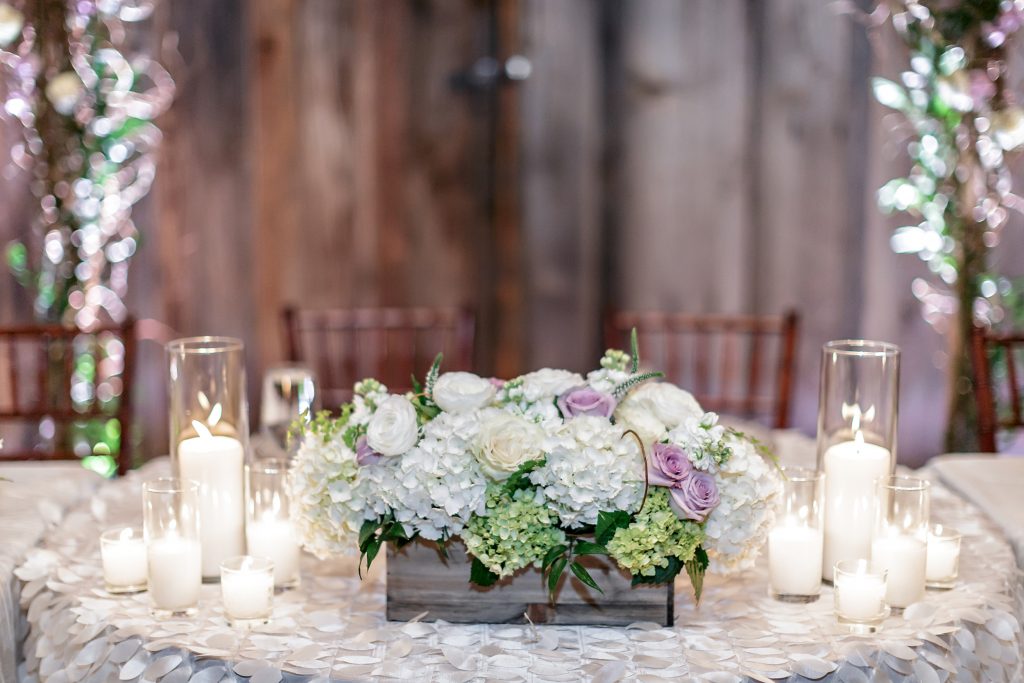 Head Table Centerpiece: long wood box of hydrangea and roses accented with candles