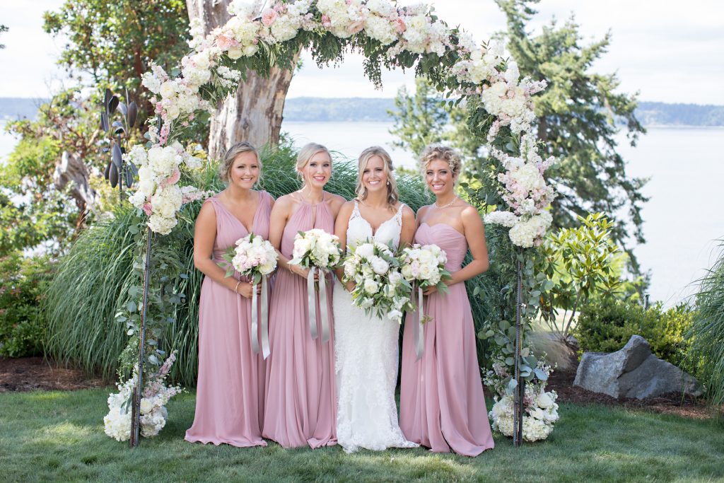 Bride and Bridesmaids.  Bouquets of hydrangea, peonies, roses, and spray roses by Jen's Blossoms