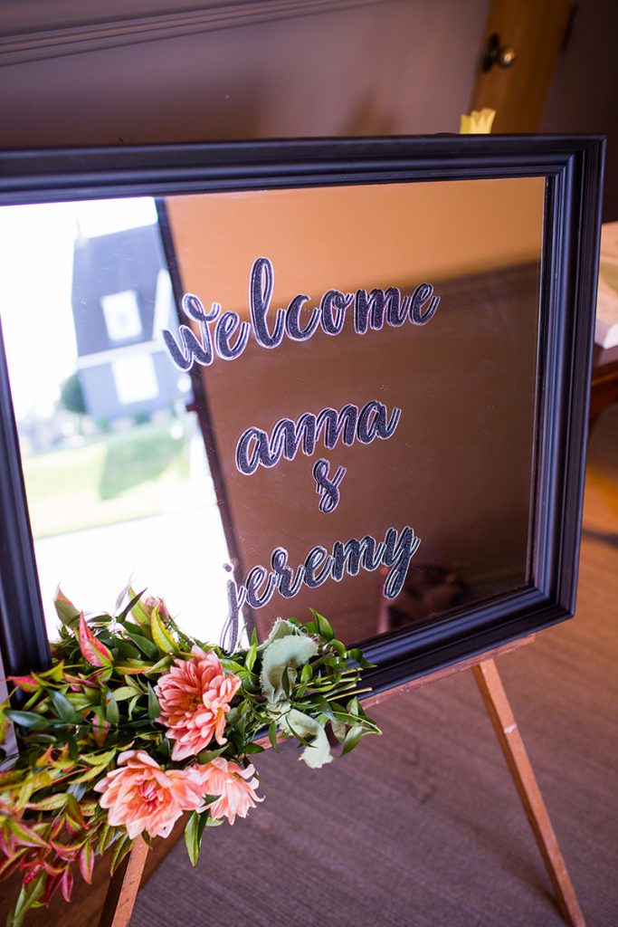 Fresh blooms on the welcome sign by Jen's Blossoms 